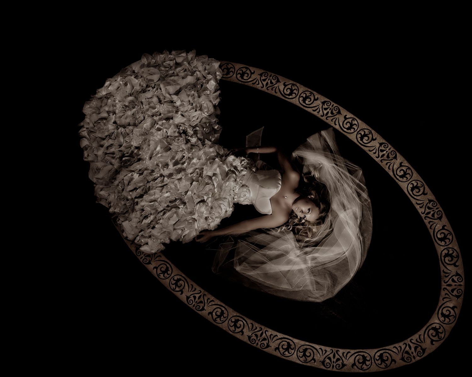 Artistic black and white photo series showing a figure in an ornate oval frame with dramatic lighting and shadows.
Horvath-Photography