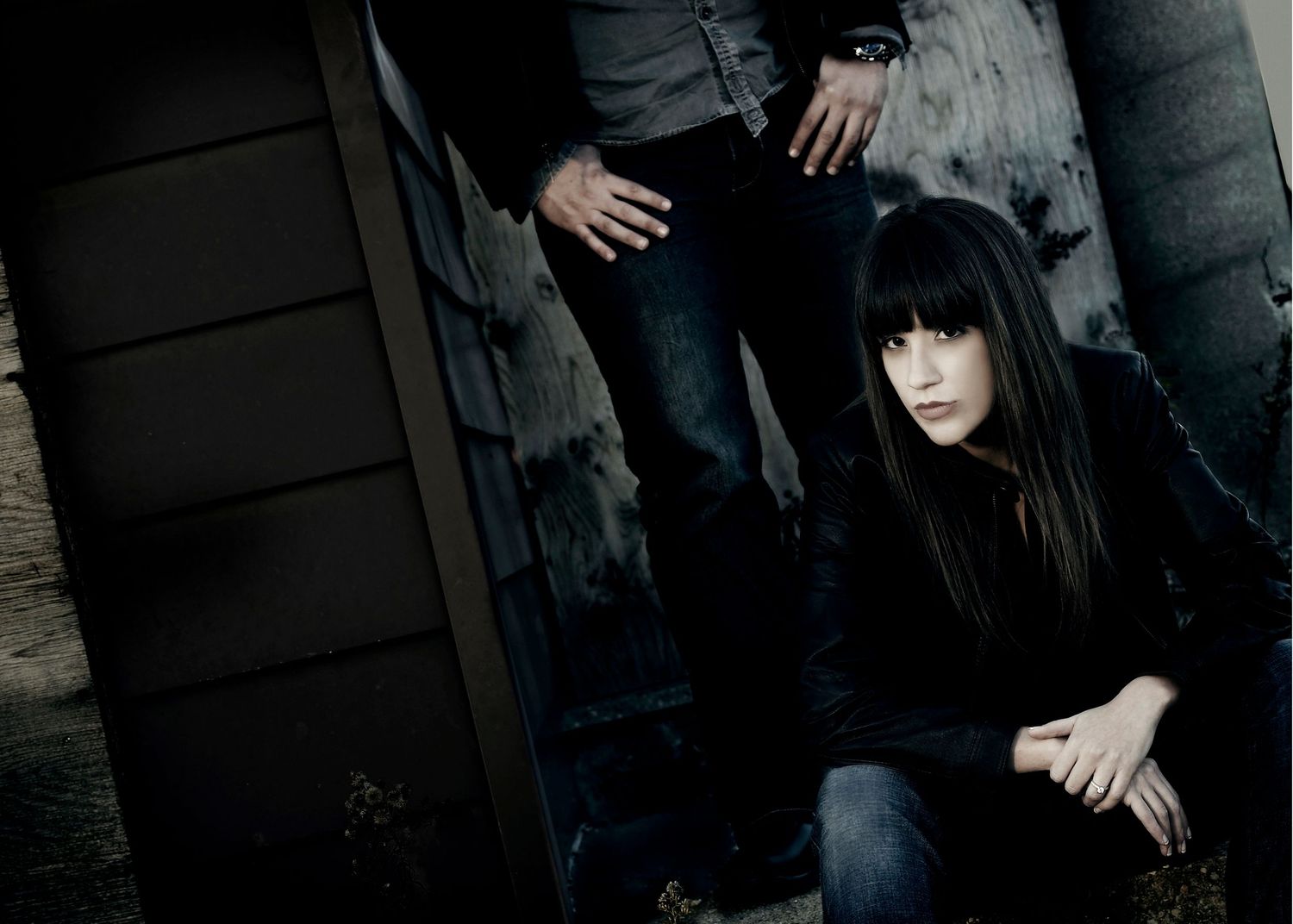 A person in a dark outfit poses against a black background in a moody editorial style photo series.
Horvath-Photography-Sam-Sciarrino
