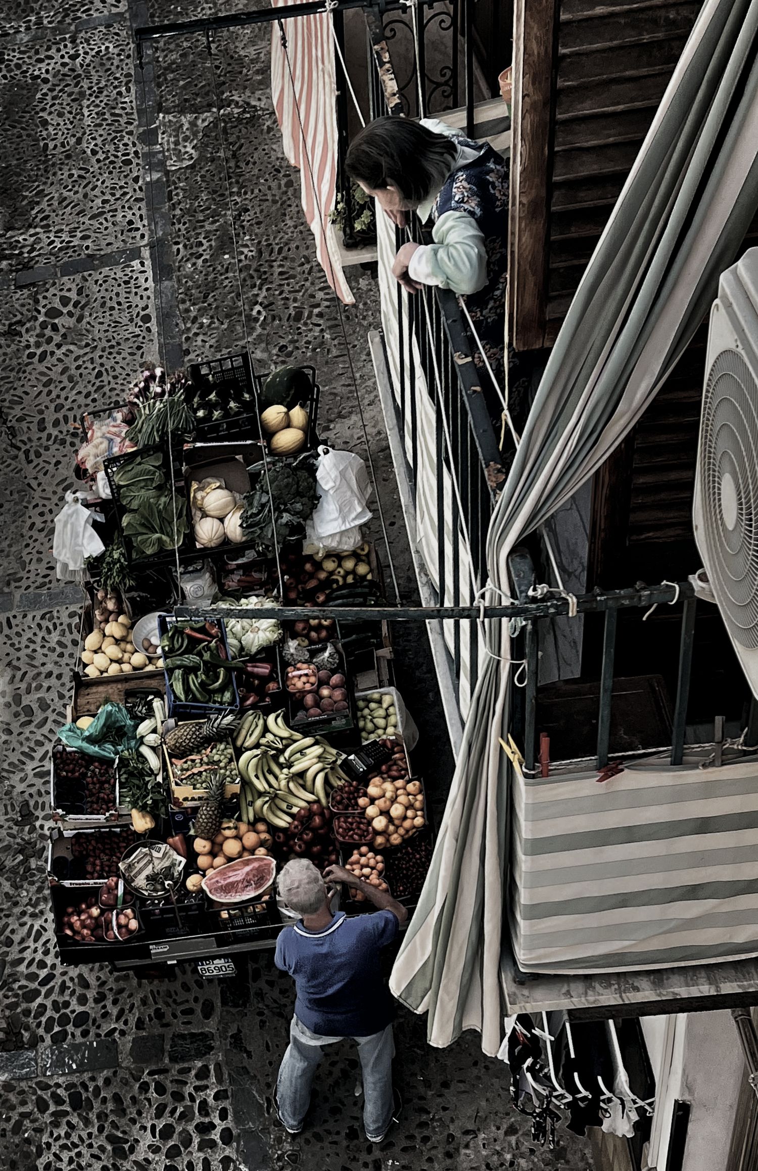 A series of photos showing a person arranging decorative items and curtains on a rustic stone wall with wooden accents.