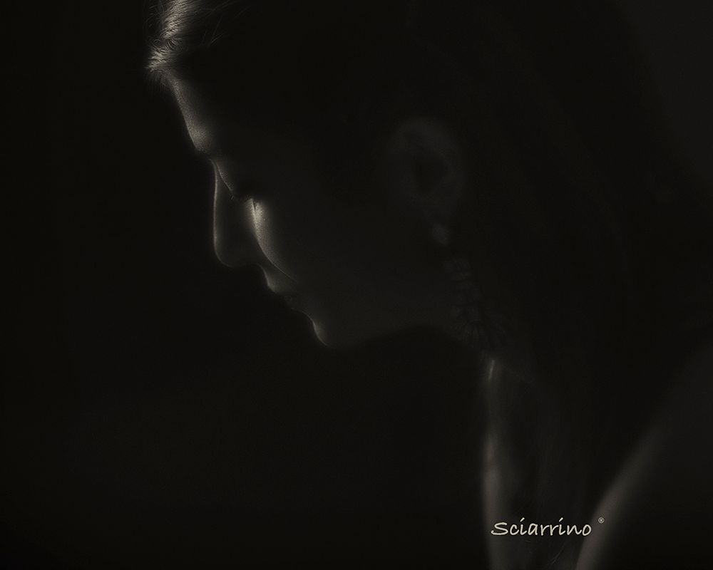 Abstract black and white series showing silhouettes and shadows in dark lighting conditions.