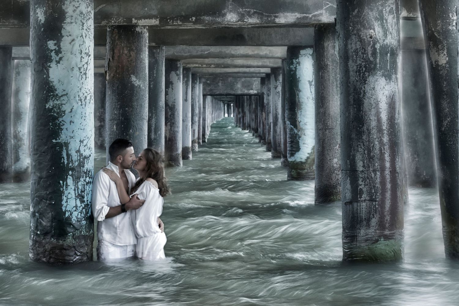 Dramatic underwater architectural scene with pillars creating a long corridor perspective.