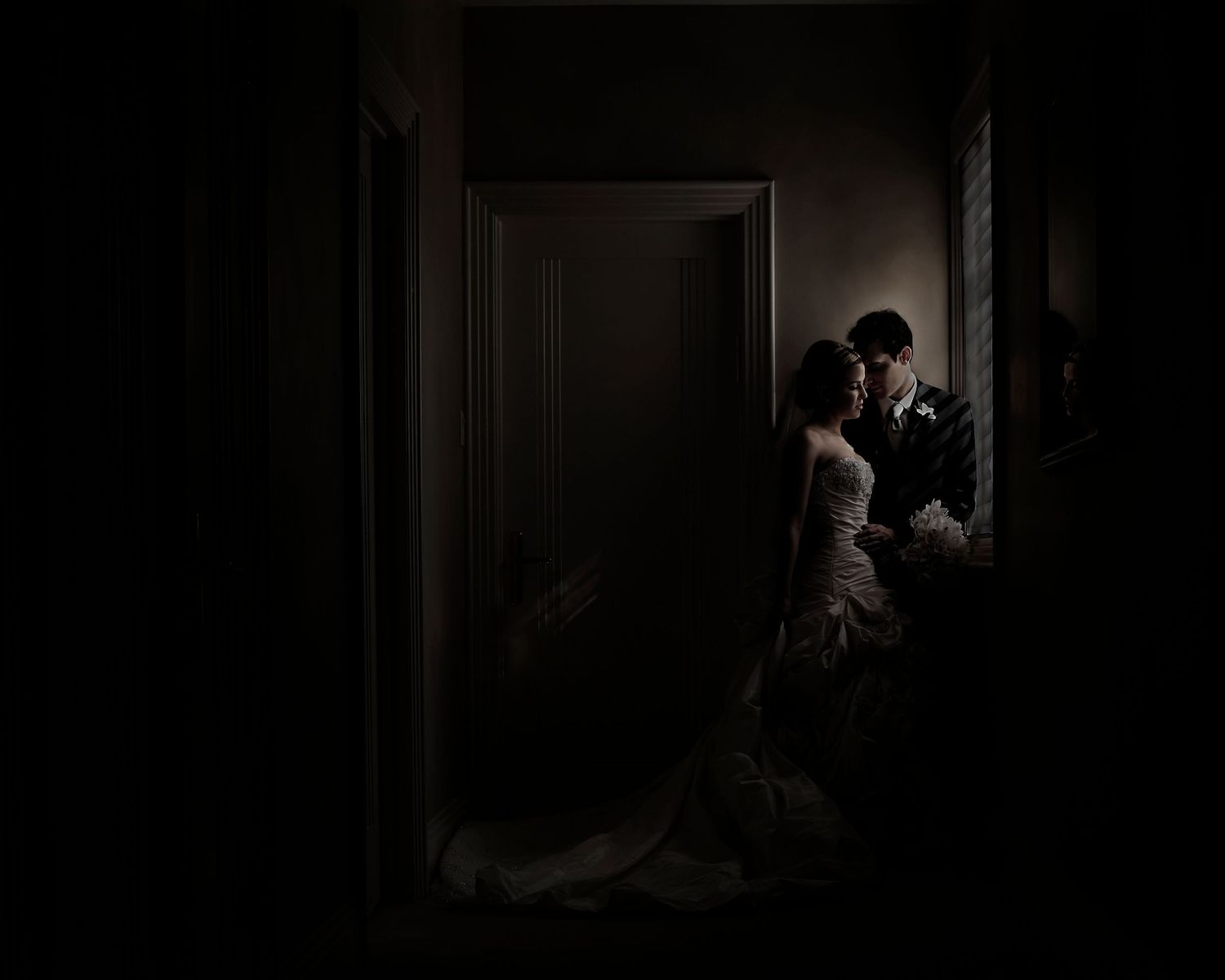 A dark and moody sequence of black and white photographs showing silhouettes in shadowy interior spaces.
Horvath-Photography-Sam-Sciarrino