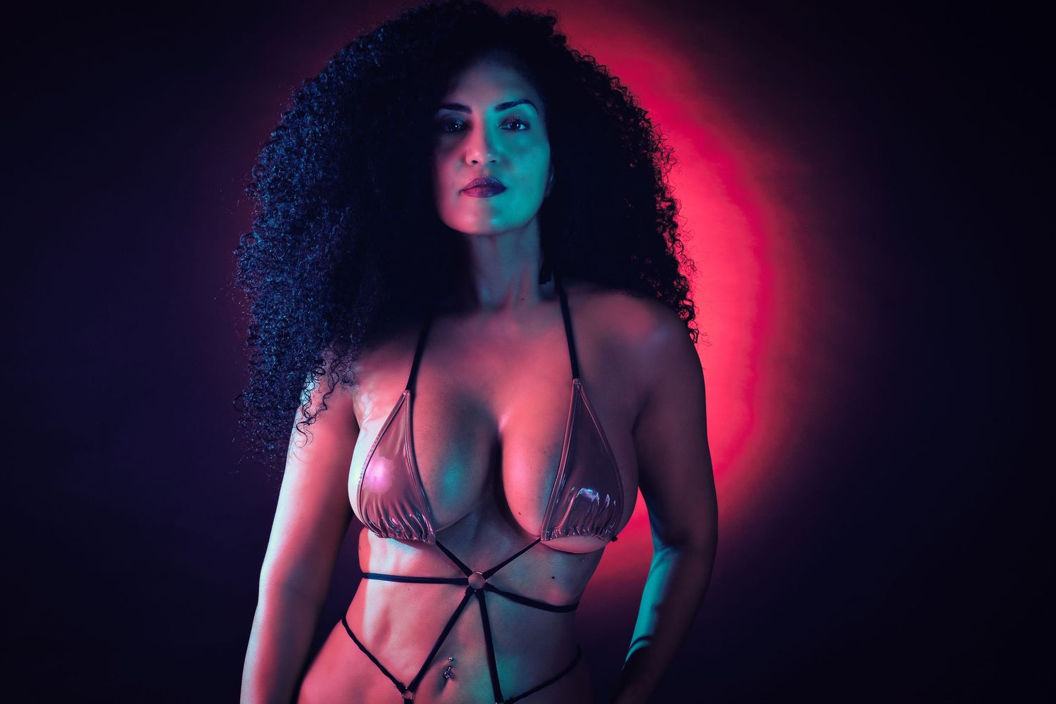 Bold creative portrait of model in red gel light by Atlanta brand and editorial photographer APQ Creative.