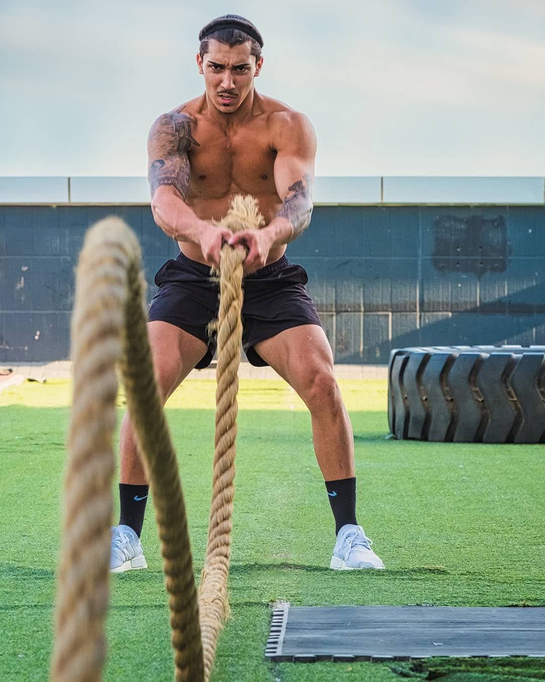 Editorial fitness portrait of male athlete training with battle ropes by Atlanta brand photographer APQ Creative.