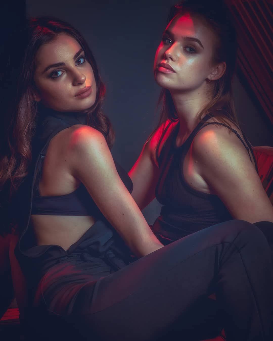 Editorial portrait of two women with cinematic gel lighting by creative portrait photographer in Atlanta, APQ Creative.