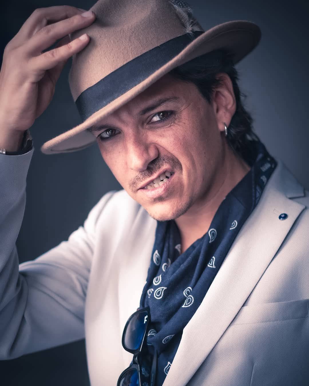 Professional branding headshot of stylish man in hat by Atlanta business photographer APQ Creative.