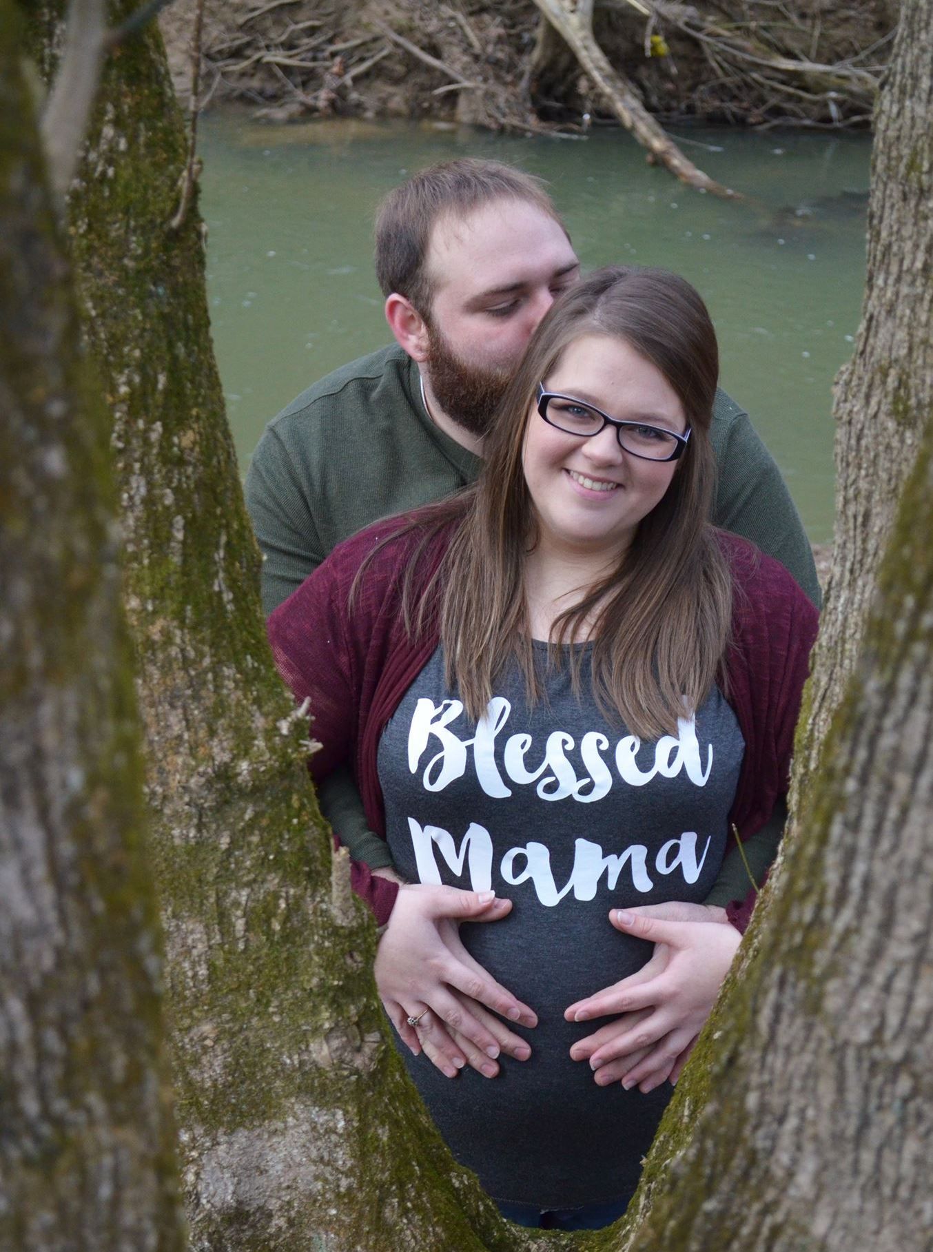 Expecting couple posing for maternity portrait session