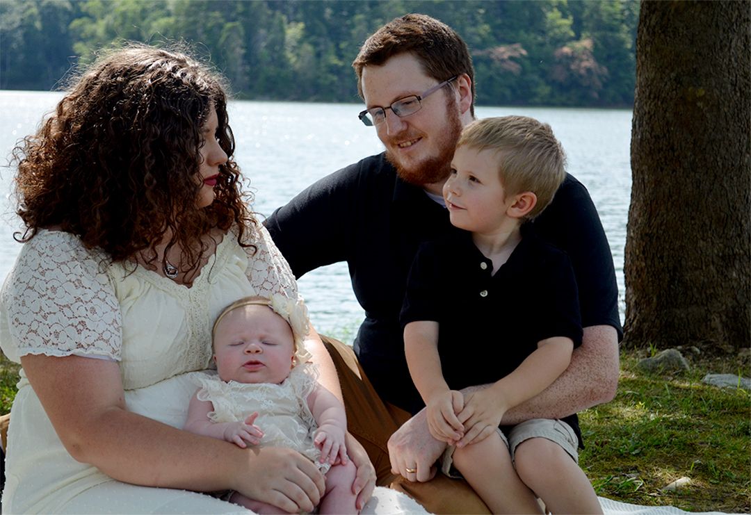 Mother and father with children during outdoor family photography session