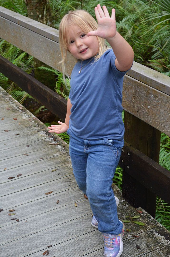 Young child striking a fun pose during portrait session in Brevard County, Florida