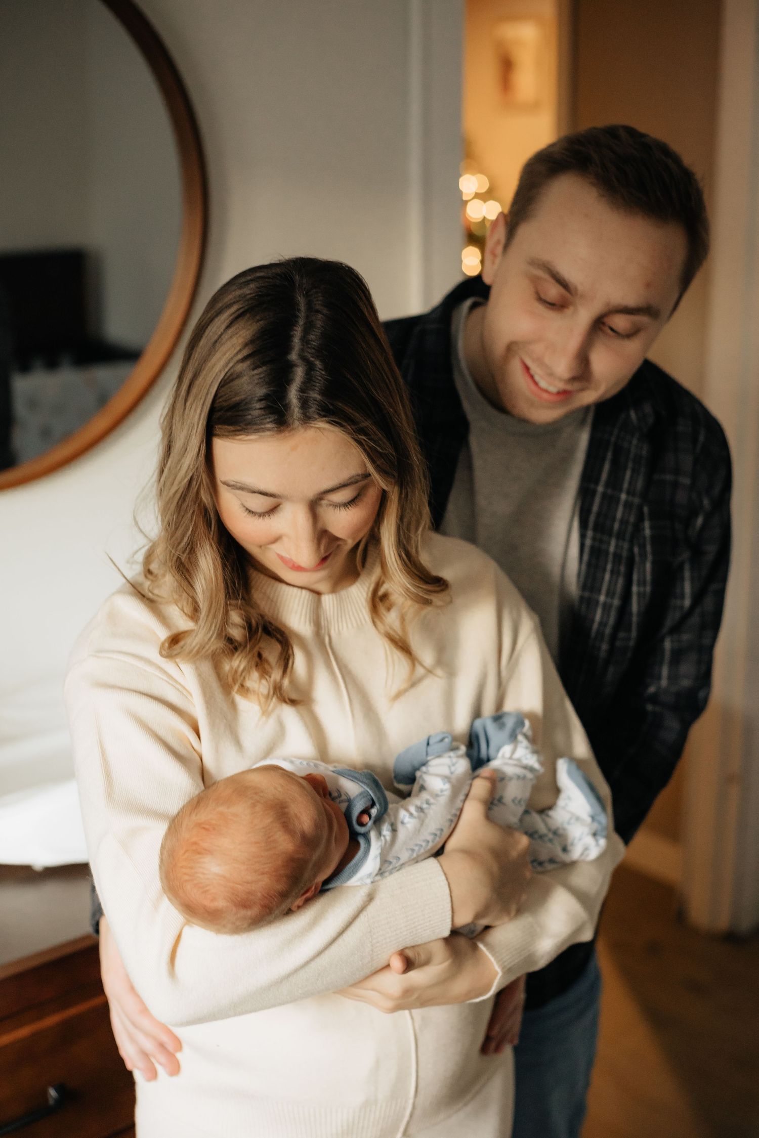 Intimate indoor family moment captured in warm lighting and neutral tones.