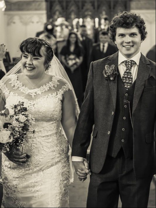 Black and white wedding photos showing a happy couple in formal attire with the bride holding a floral bouquet.