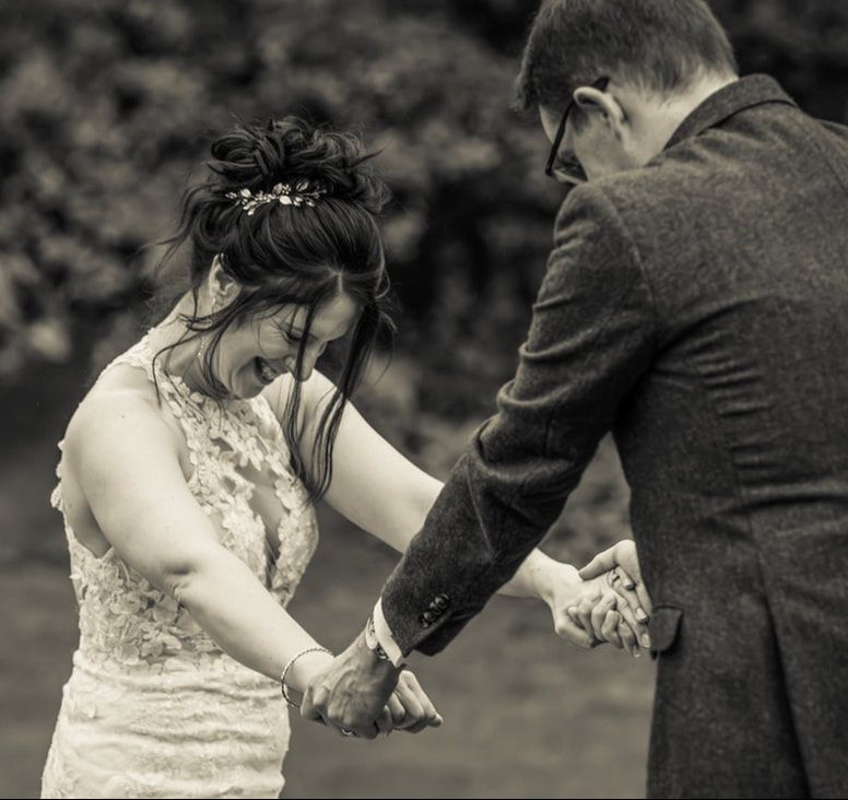 A series of black and white wedding photos showing a couple holding hands and embracing during their ceremony.