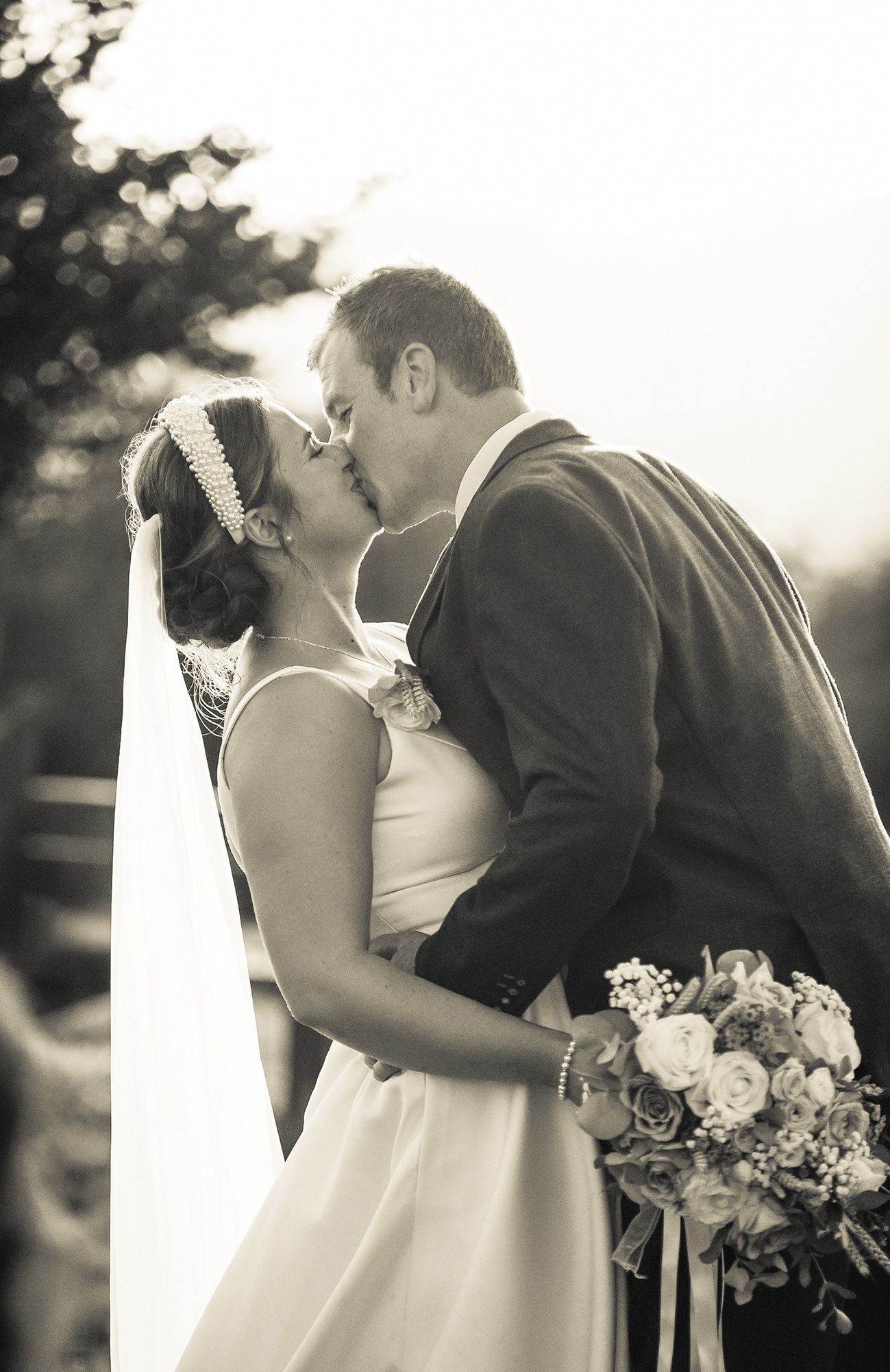 Romantic black and white wedding photos showing tender moments between newlyweds looking over the views at the farm marquee wedding, Enmore.