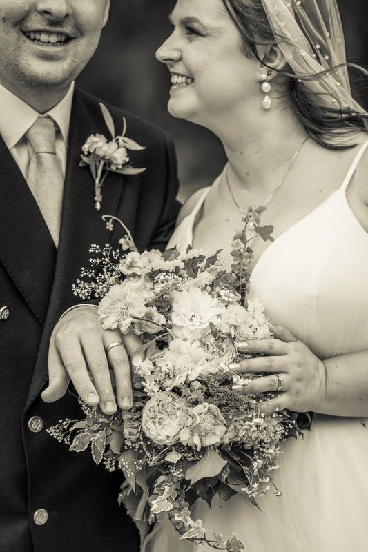 Black and white wedding photography collage showing close-up details of newlyweds with floral bouquet and formal attire.