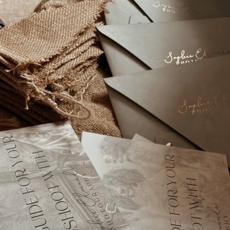 Handwritten calligraphy text on vintage parchment paper with elegant cursive lettering in a sepia-toned composition.
