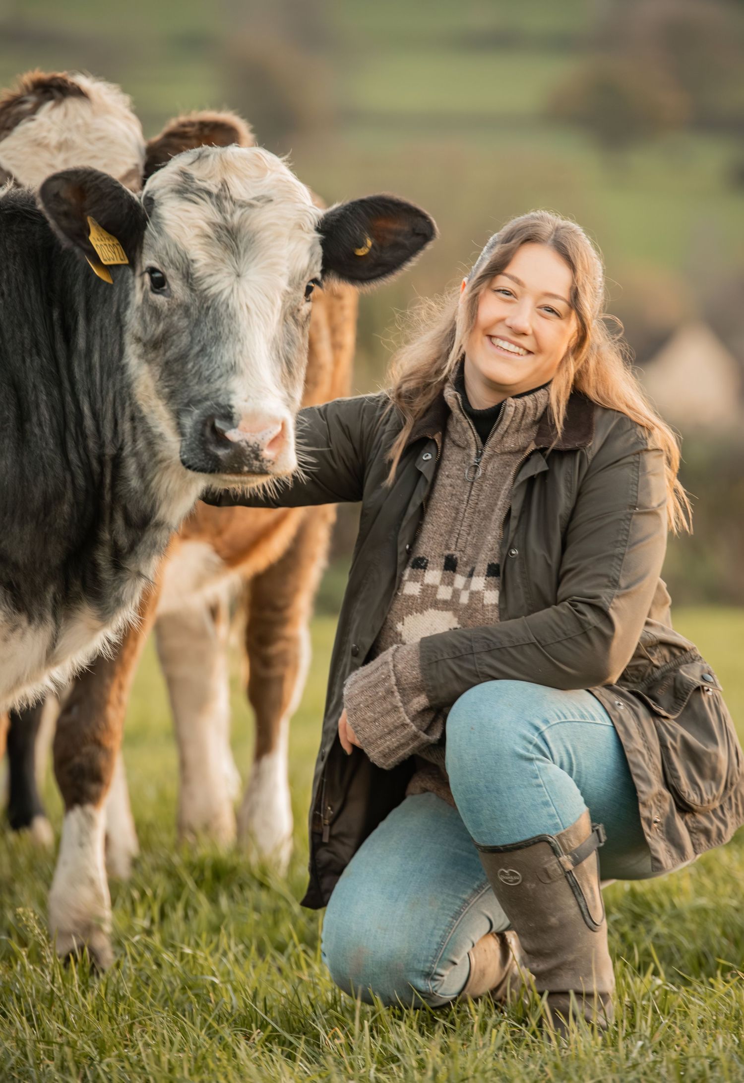 A series of candid moments showing interaction between a donkey and someone in jeans and a brown jacket on grassy field.