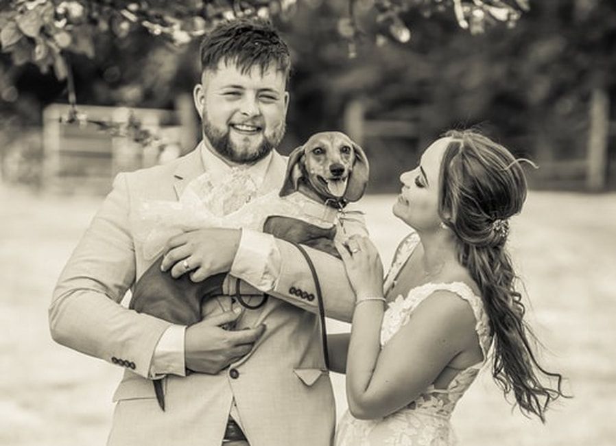 A collection of black and white wedding photos showing intimate moments between newlyweds during their celebration.