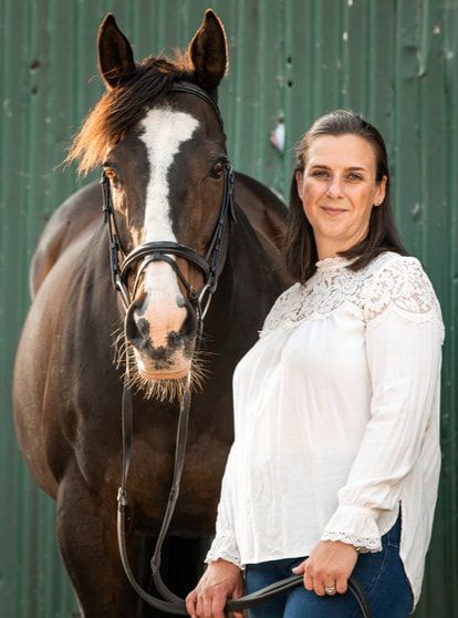 A woman in a white blouse poses with a dark brown horse against a green barn wall in a series of similar shots.