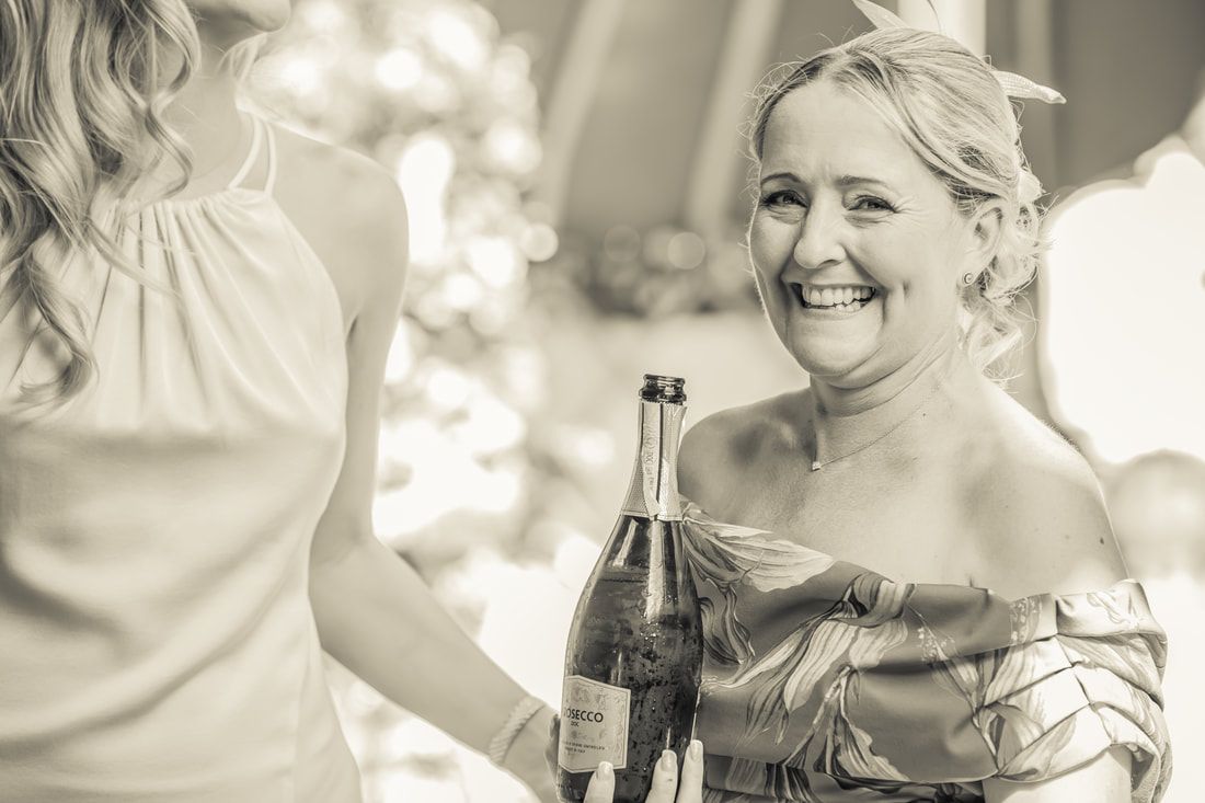 A series of black and white wedding photos showing romantic moments between a couple in vintage-inspired settings.
