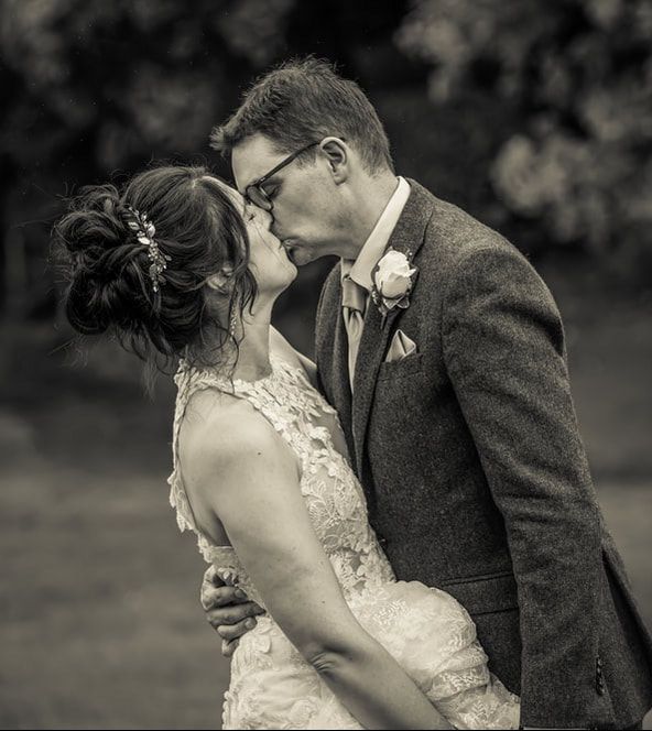A black and white photo sequence shows a couple sharing a romantic moment during their wedding ceremony.