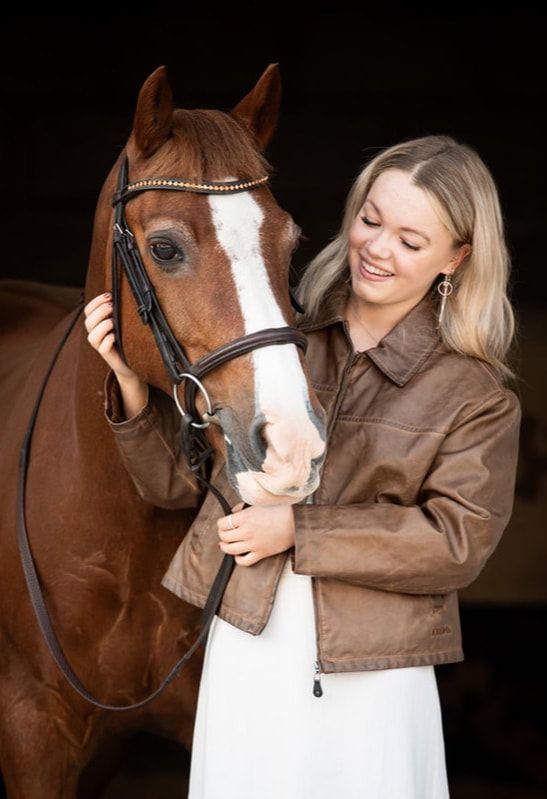 A woman in a brown leather jacket embraces a chestnut horse with a white blaze in a series of affectionate poses.