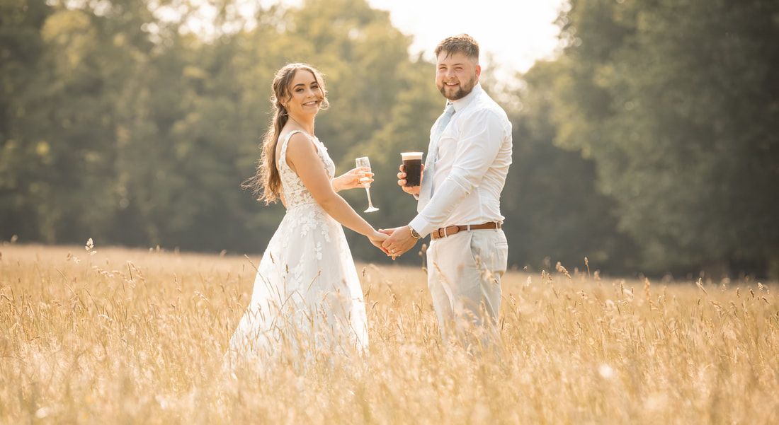A couple shares romantic moments in a sunlit golden field during sunset, captured in a series of intimate poses.
