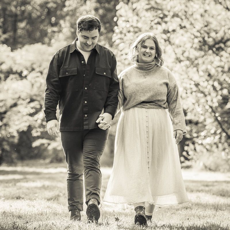 A couple walking together in a park setting on a sunny day, captured in a series of black and white photographs.