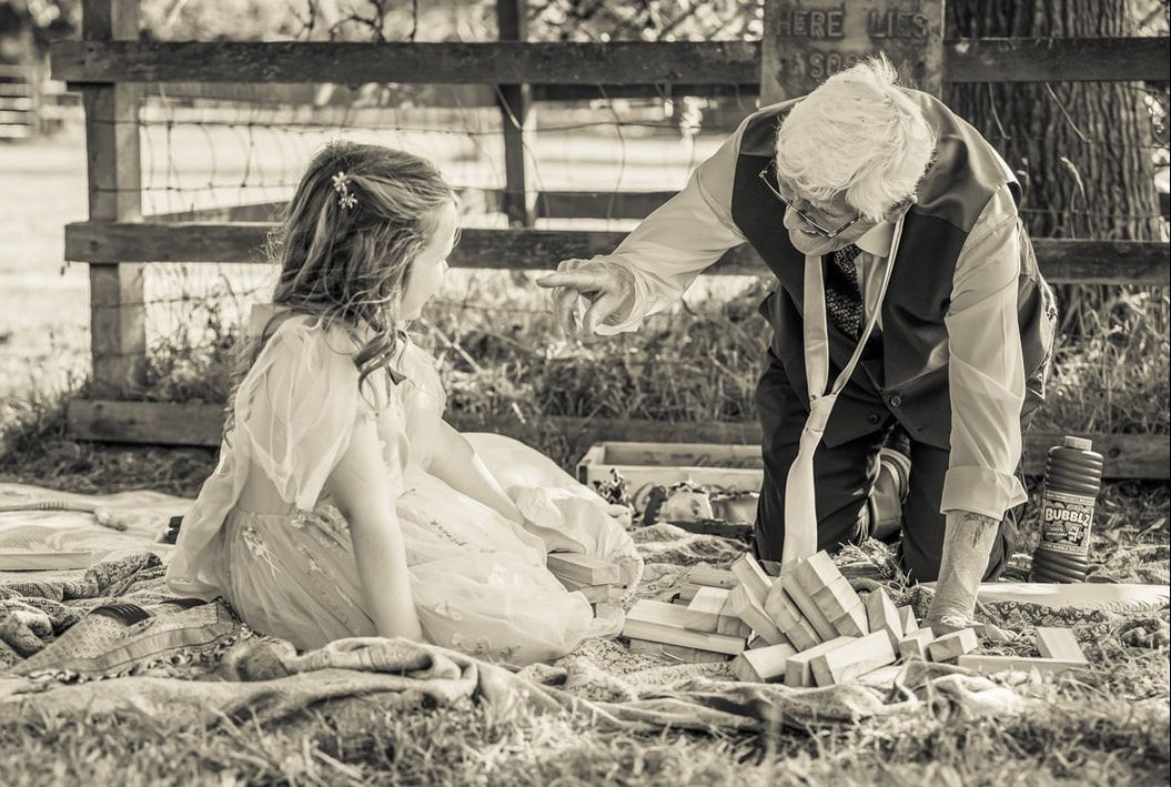 Vintage black and white photo series showing couple sitting together in garden setting in romantic poses.