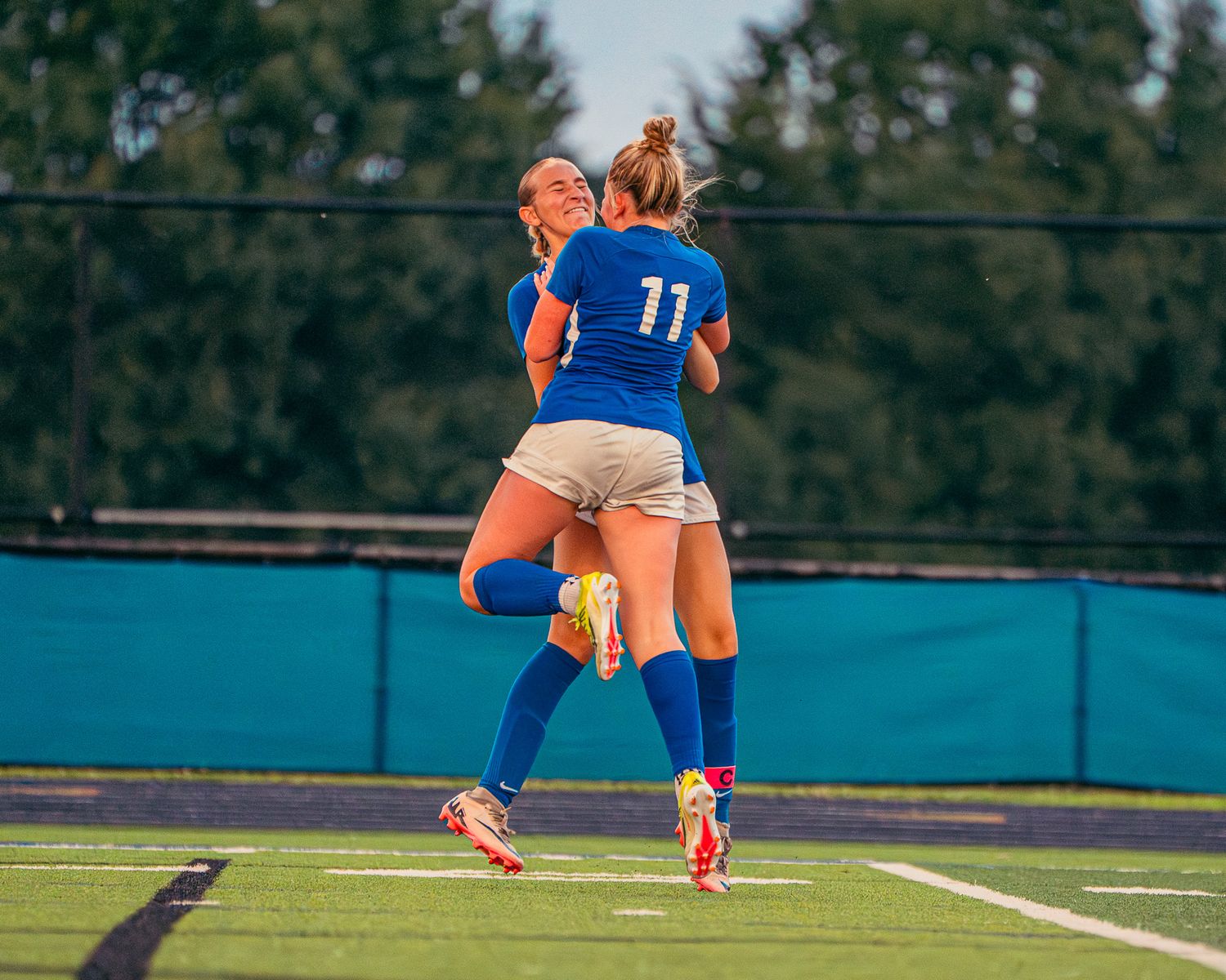 Soccer players celebrating a goal