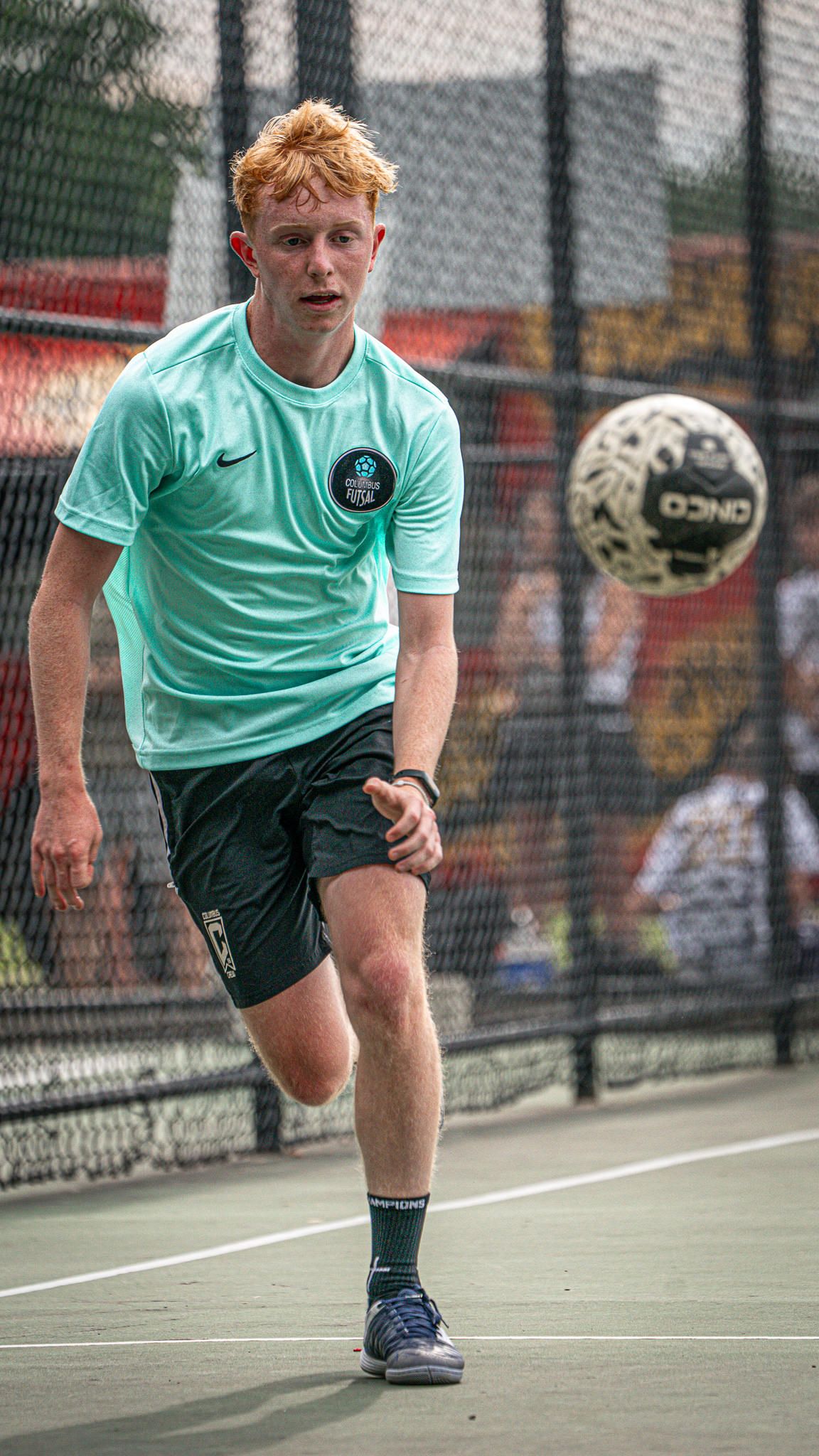 A player chasing a bouncing ball