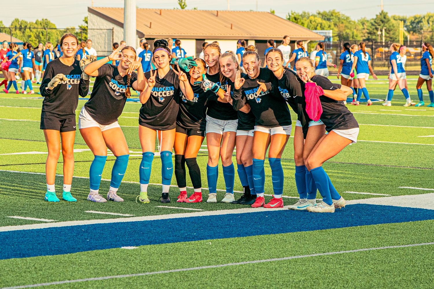 Soccer players posing for a picture