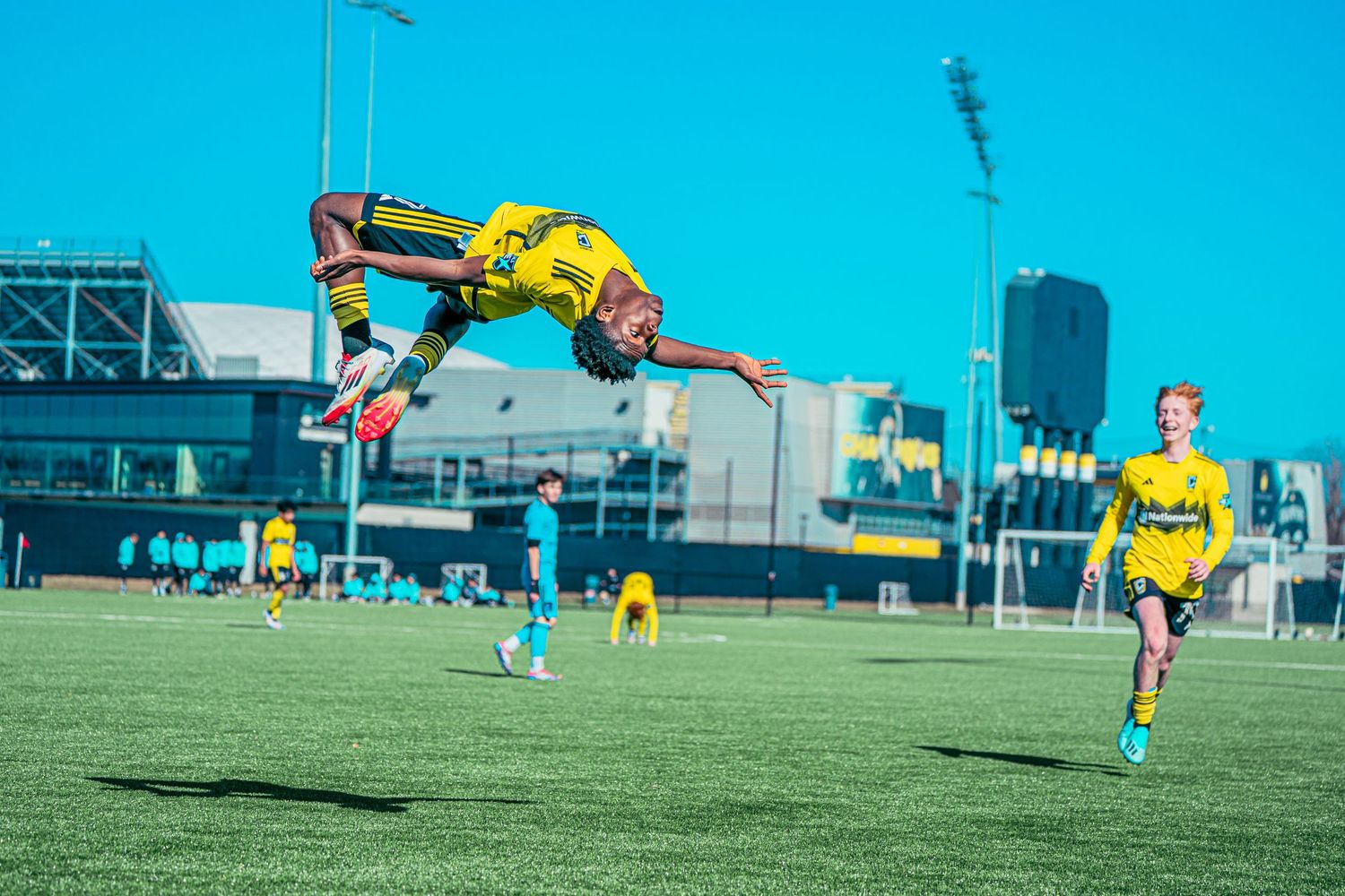 Soccer player celebrating with a backflip