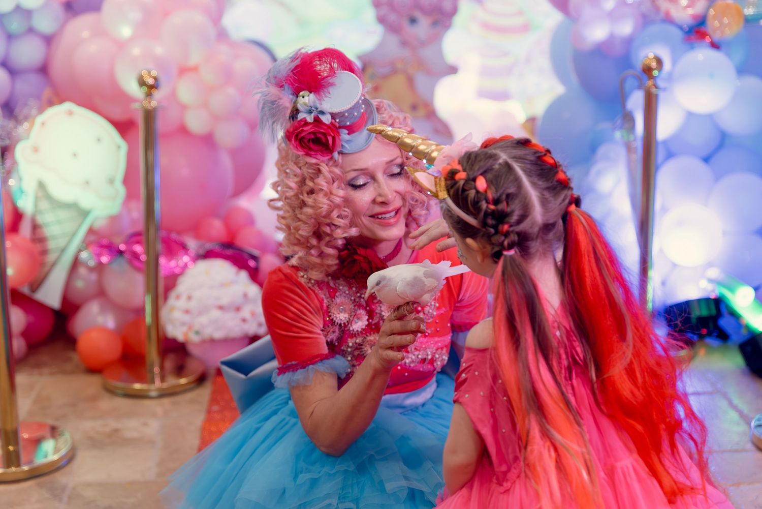 A whimsical party scene with colorful balloons and ice cream decorations in the background.