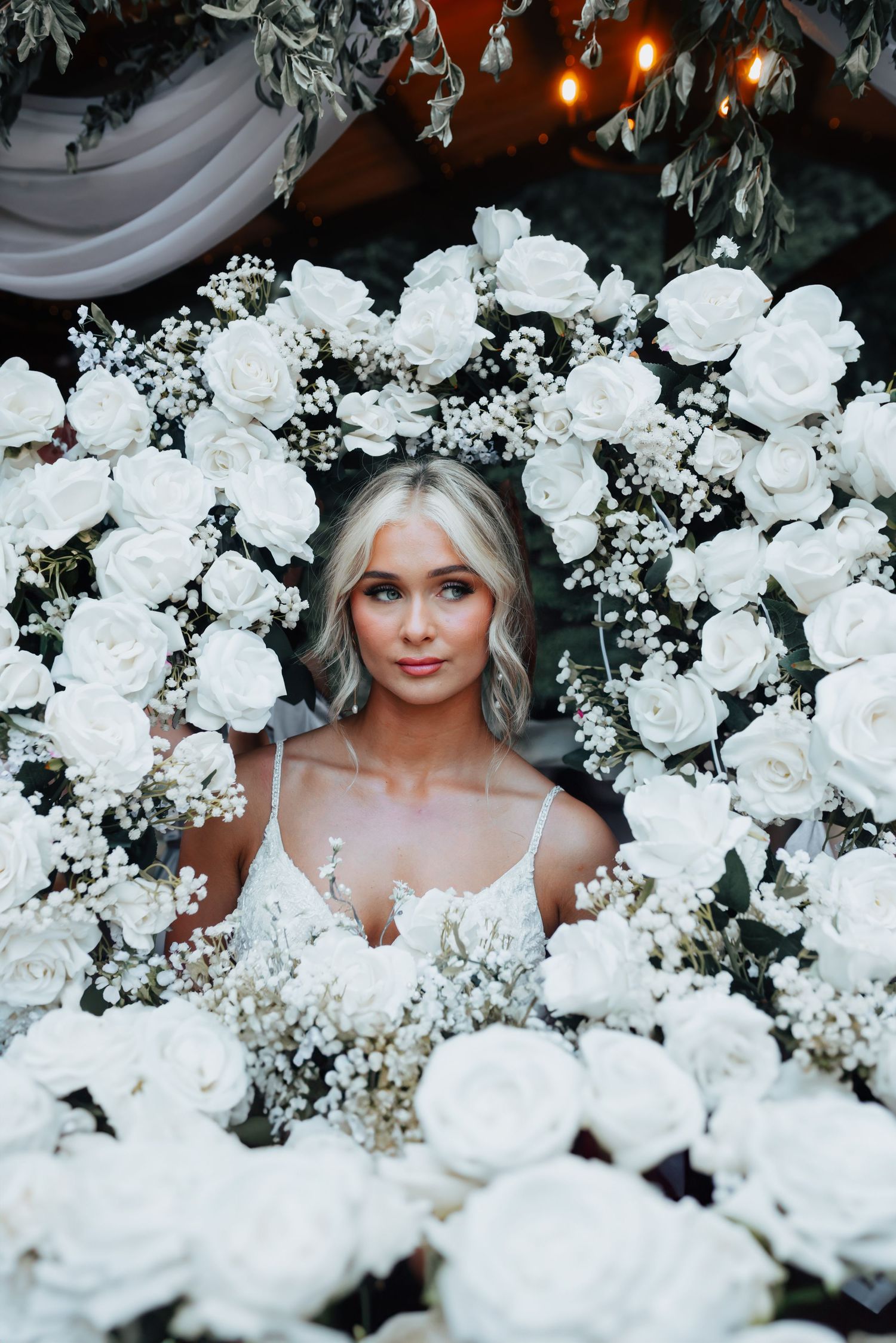 Elegant white roses and baby's breath flowers create a romantic floral arrangement.