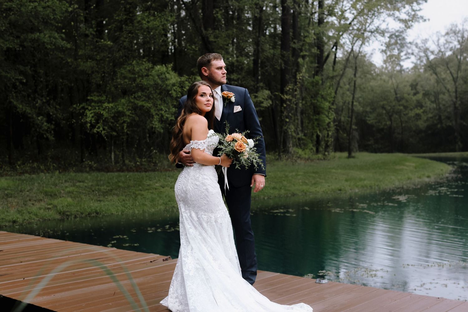 Beautiful outdoor ceremony setting by a serene turquoise lake.