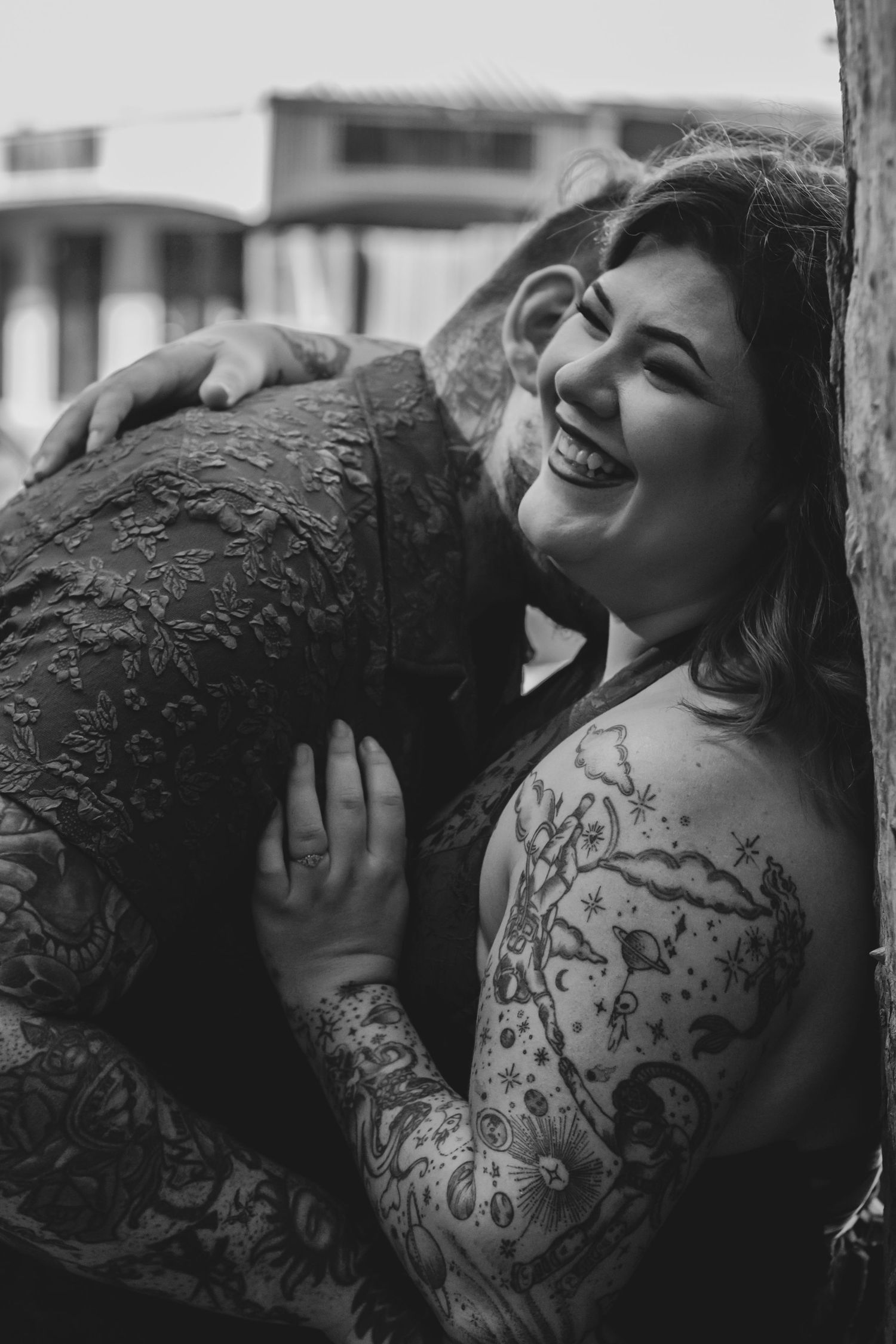 Couple embracing during a romantic morning photography session in Hervey Bay.