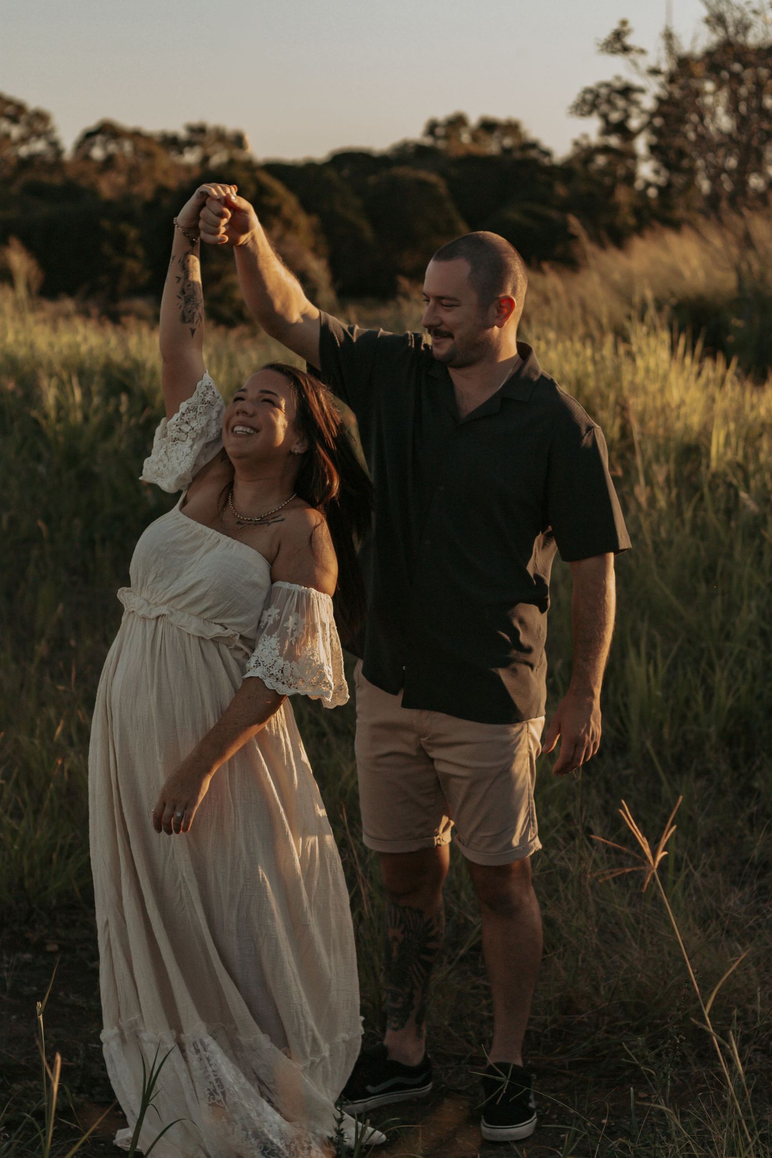Engagement session of these two lovers in a golden field at sunset. Couples Photography