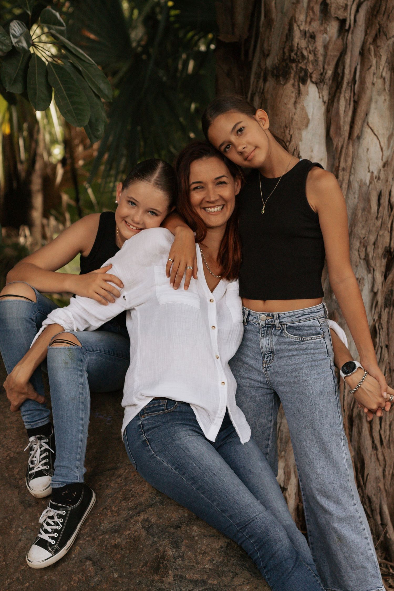 A mother with her two girls in a family photo shoot at Queens Park in Maryborough