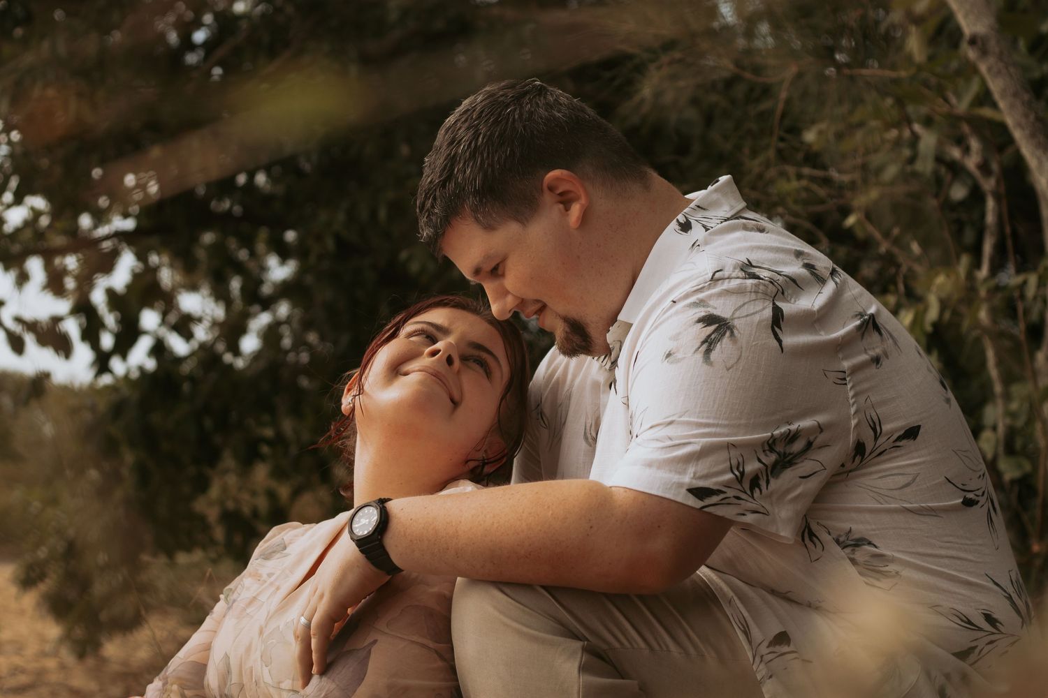 Newly married couple embracing during romantic session after their vows photography session in Hervey Bay.