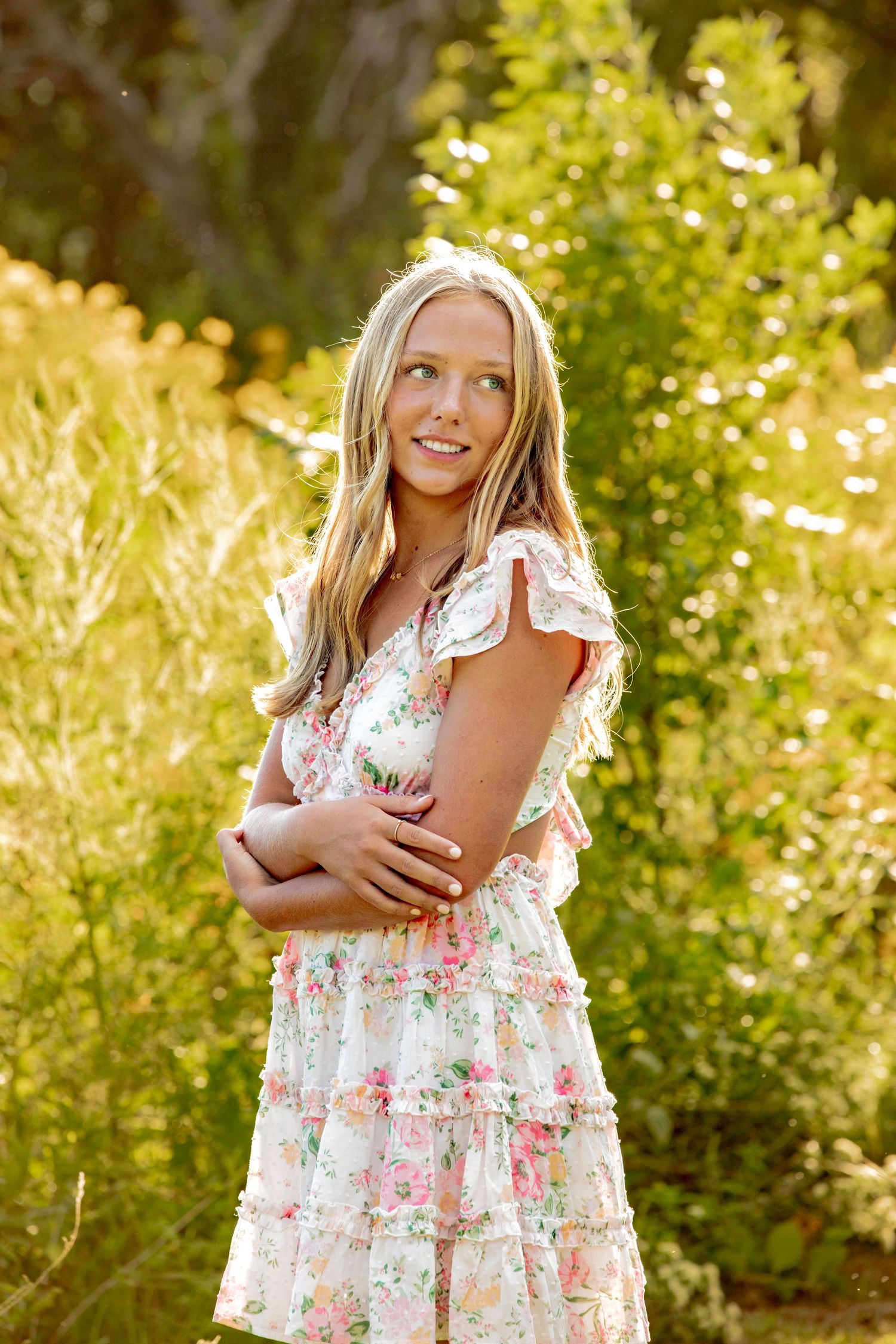 A sequence of outdoor portraits in a floral dress against a sunny natural background.