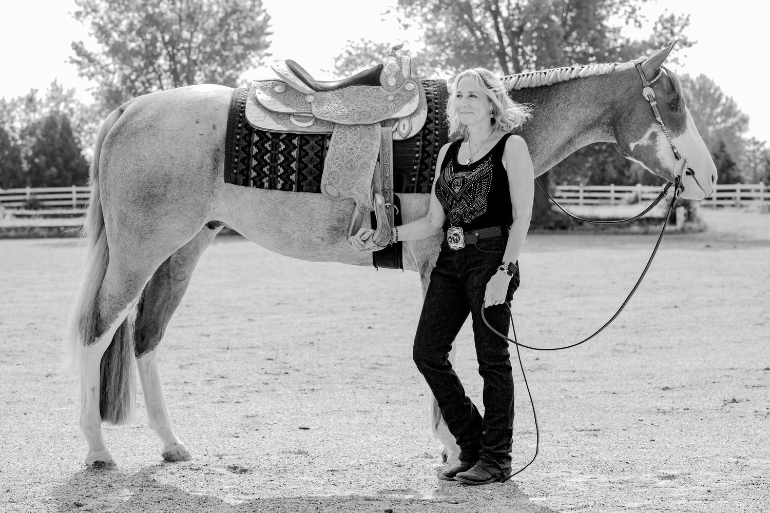 A step-by-step photo sequence showing someone putting on their horse riding boots and preparing to mount a white horse.