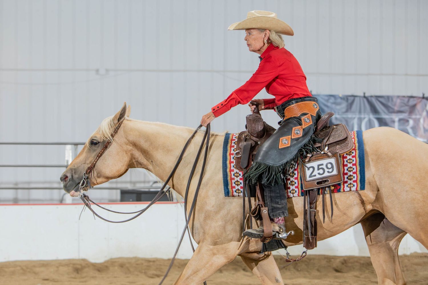 Sequential shots of western horseback riding showing movement across an arena.