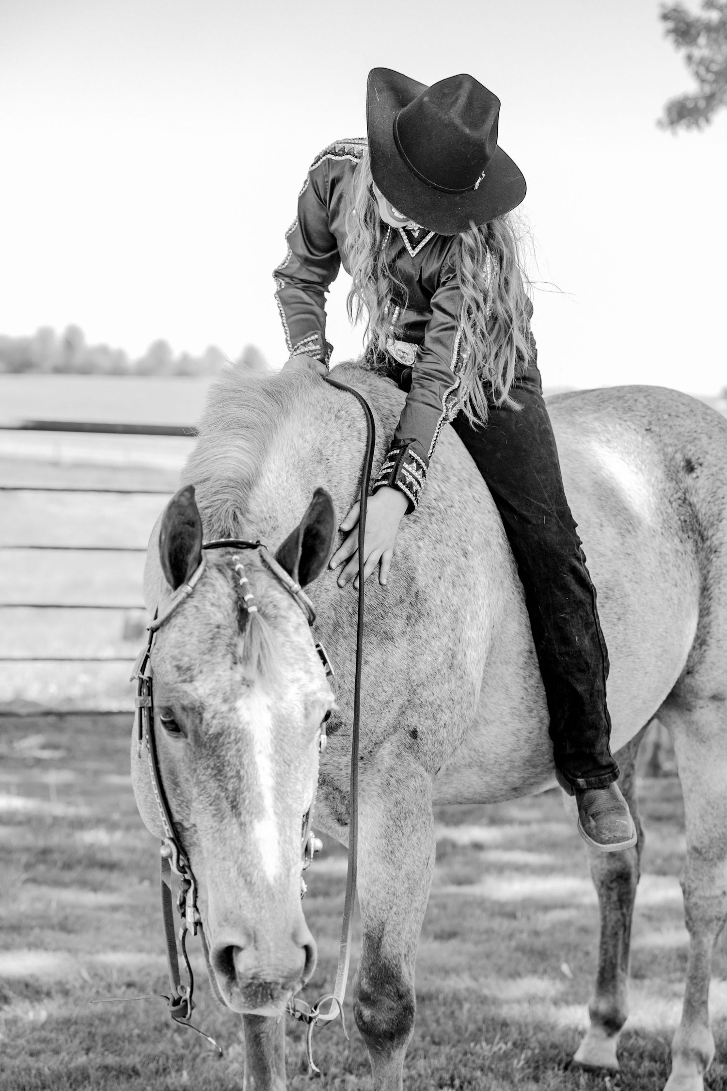 Vintage black and white photographs of a light-colored horse with western tack.