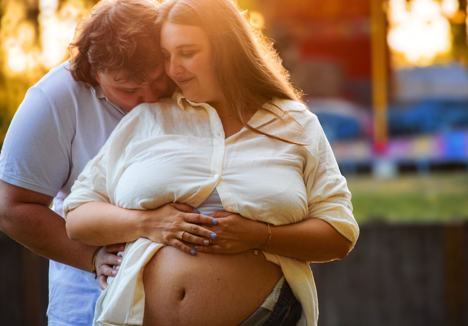 Intimate couple's photoshoot at golden hour showing tender embraces and natural lighting.