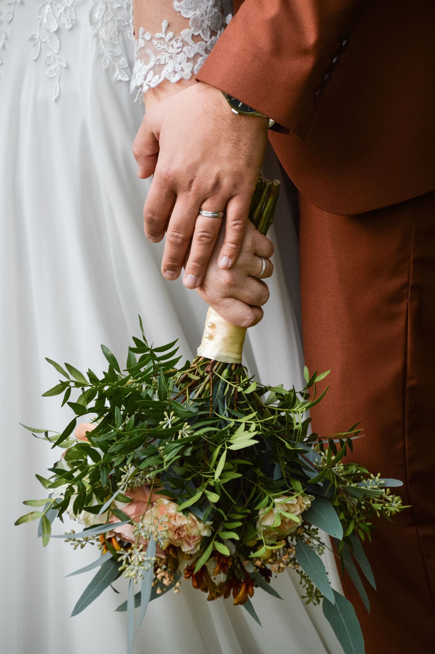 Close-up shots of wedding bouquet with green foliage and floral details against white and brown backgrounds.