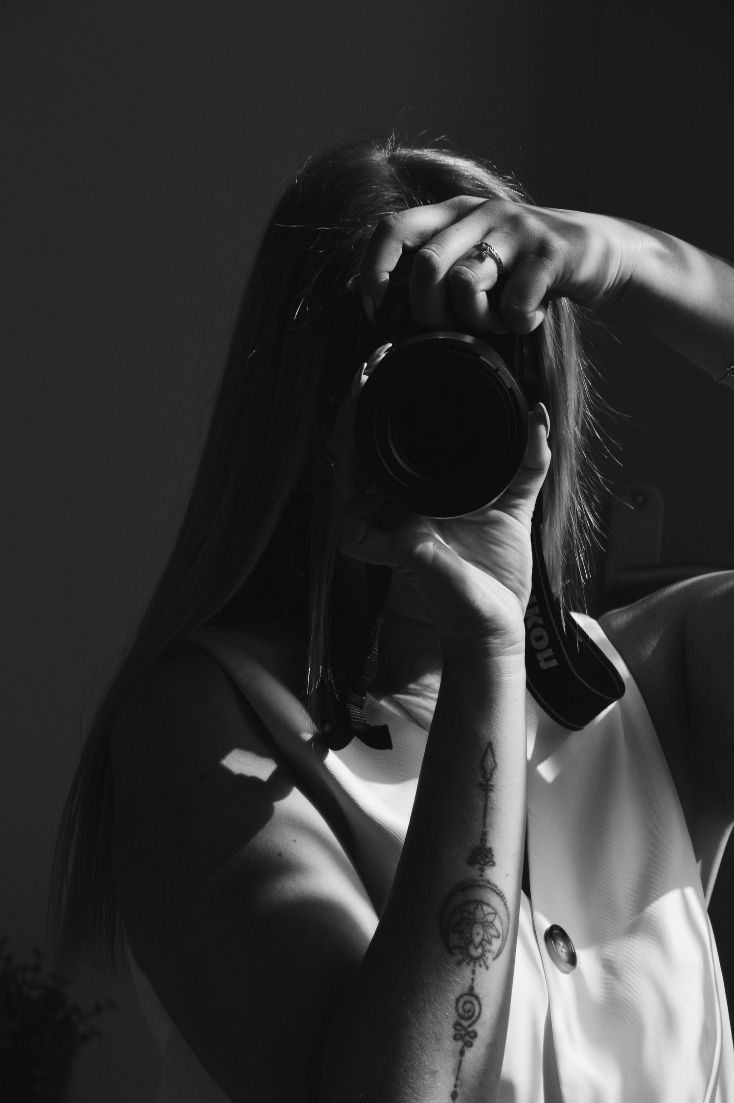 Artistic black and white photos showing silhouettes and shadows in dramatic lighting.