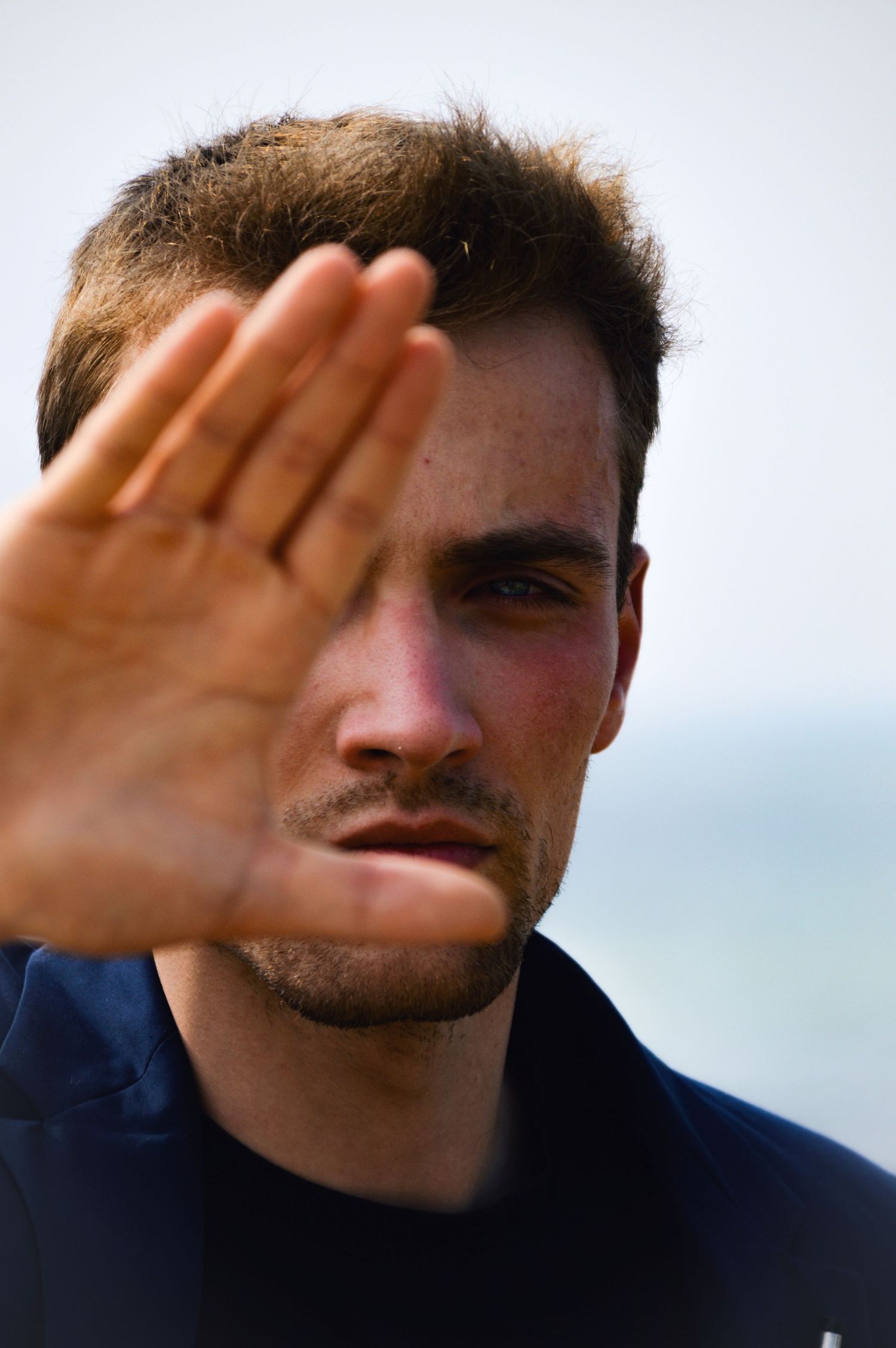 Series of close-up shots showing a hand blocking sunlight against a bright sky.