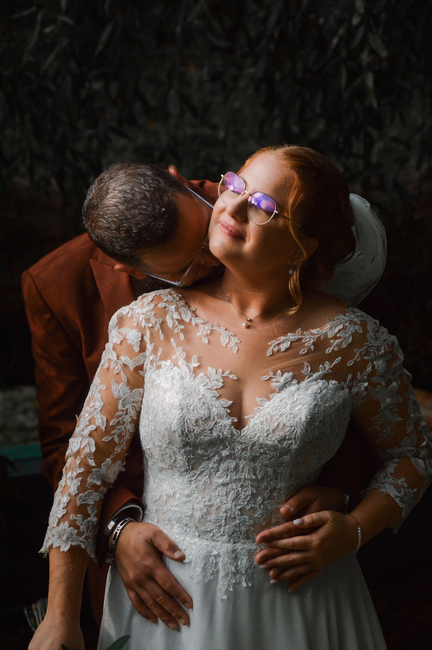 Detail shots of a white lace wedding dress bodice with intricate embroidery patterns.