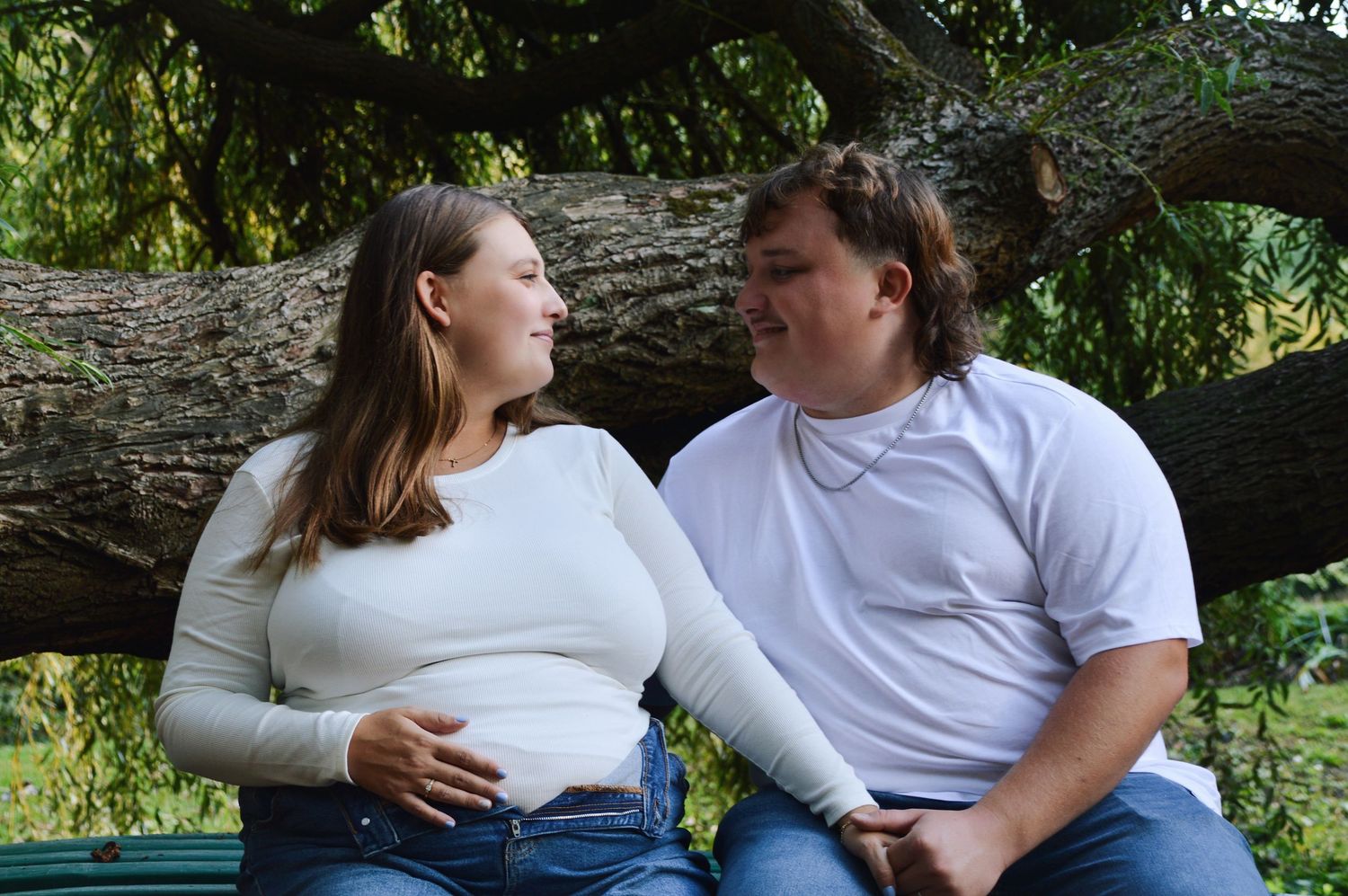 Intimate outdoor couple's photography session in natural setting.