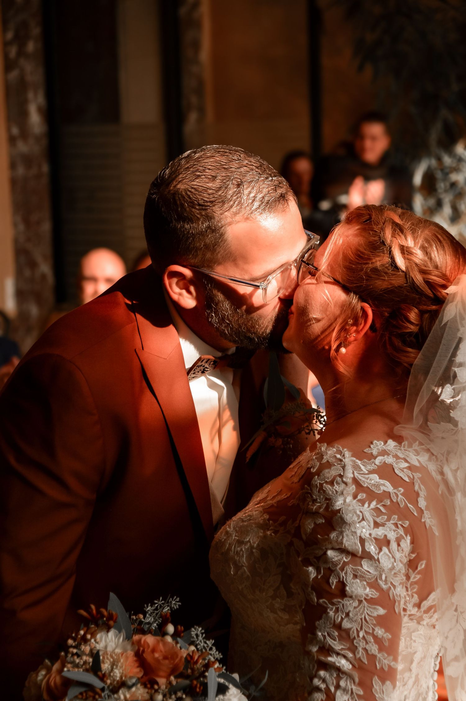 Intimate wedding couple moments captured in warm lighting during sunset.